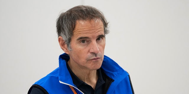 Rafael Mariano Grossi, Director General of the International Atomic Energy Agency, seen in a blue vest taking a reporter's question