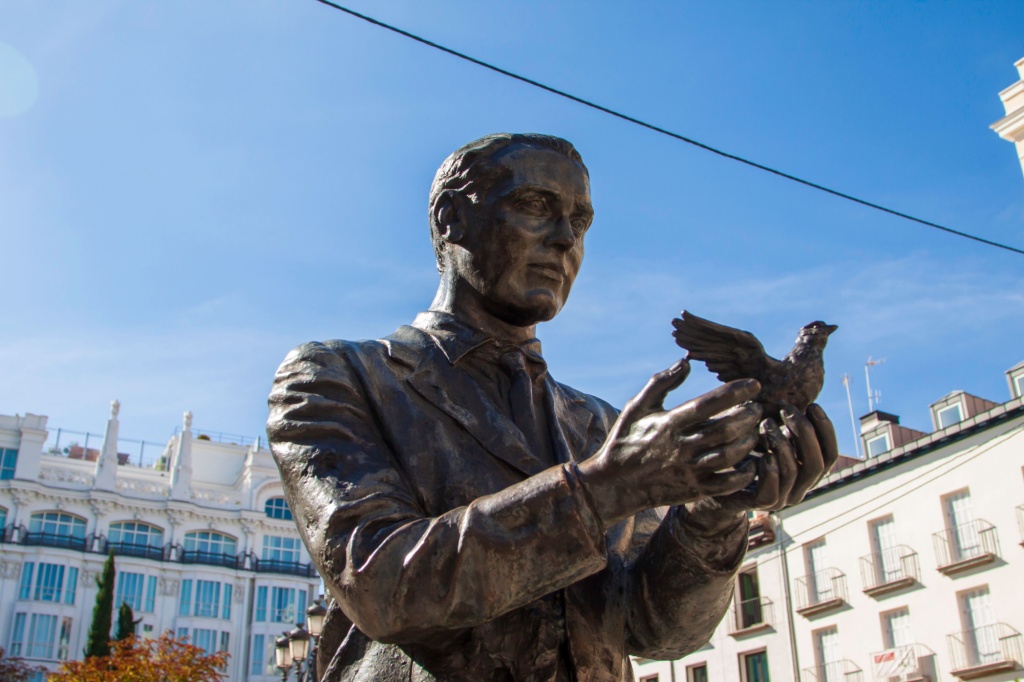 Statue of the famous poet, Federico García Lorca with a pigeon on Saint Anne Square (Plaza de Santa Ana) in Madrid, Spain