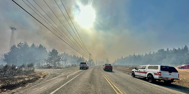 smoke blocking out sun on roadway