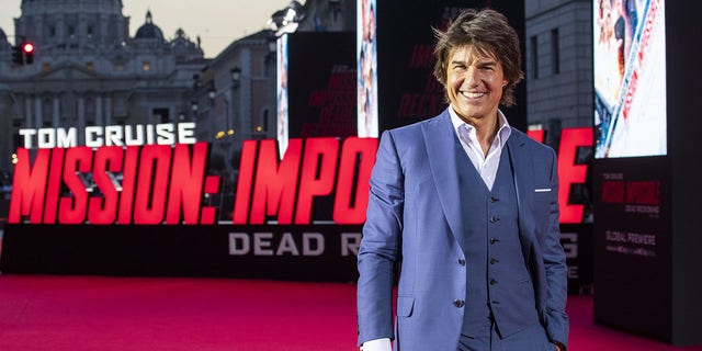 Tom Cruise walks red carpet at Mission Impossible premiere
